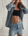 Relaxed high rise vintage shorts. Button fly closure. Distressed. Unlined. No stretch. light wash denim shorts. frayed shorts. mid to high rise shorts