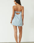 Woven dress. Inner rubber grip lining. Side pockets. Elastic back strap. Back cut out. Partially lined. Blue mini dress. blue strapless mini dress. guest wedding dress. summer dress. summer outfit.