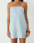Woven dress. Inner rubber grip lining. Side pockets. Elastic back strap. Back cut out. Partially lined. Blue mini dress. blue strapless mini dress. guest wedding dress. summer dress. summer outfit.