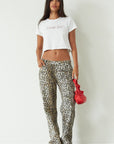 Printed jeans. Button and zipper fly. Five pocket construction. Unlined. cheetah pants. cheetah jeans. leopard jeans. leopard pants