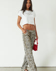 Printed jeans. Button and zipper fly. Five pocket construction. Unlined. cheetah pants. cheetah jeans. leopard jeans. leopard pants