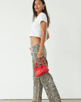 Printed jeans. Button and zipper fly. Five pocket construction. Unlined. cheetah pants. cheetah jeans. leopard jeans. leopard pants