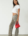 Printed jeans. Button and zipper fly. Five pocket construction. Unlined. cheetah pants. cheetah jeans. leopard jeans. leopard pants