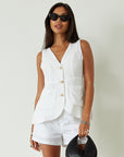 Woven sleeveless top. Front button down closure. Front pockets. Fully lined. white vest top. summer top. summer outfit. cute casual. cute but comfy top
