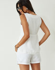 Woven sleeveless top. Front button down closure. Front pockets. Fully lined. white vest top. summer top. summer outfit. cute casual. cute but comfy top