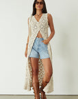 Relax fit mid-length denim shorts. Button fly. Five pocket construction. Raw hem. Unlined. denim shorts. light wash denim shorts. medium wash denim shorts