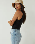 Relax fit mid-length denim shorts. Button fly. Five pocket construction. Raw hem. Unlined. denim shorts. light wash denim shorts. medium wash denim shorts