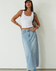 Denim maxi skirt. Button and zipper fly. Five pocket construction. Back slit. Raw hem. Unlined. blue denim maxi skirt. denim maxi skirt with back slit. summer outfit. casual outfit. cute casual outfit.