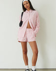 Striped boxer shorts. pink boxer shorts. pink striped boxer shorts. boxer short set. cute casual outfit. pink button up shirt. lounge set. pink lounge set. summer outfit. cute summer outfit.