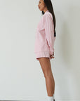 Striped boxer shorts. pink boxer shorts. pink striped boxer shorts. boxer short set. cute casual outfit. pink button up shirt. lounge set. pink lounge set. summer outfit. cute summer outfit.