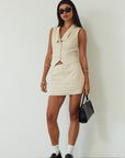 Woven sleeveless top. Front button down closure. Fully lined. Woven skirt. Hook and eye and zipper fly. Side pockets. Fully lined. summer set. cute casual outfit. summer outfit. skirt set. vest top set. tan skirt and vest set