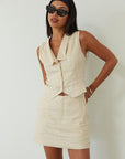 Woven sleeveless top. Front button down closure. Fully lined. Woven skirt. Hook and eye and zipper fly. Side pockets. Fully lined. summer set. cute casual outfit. summer outfit. skirt set. vest top set. tan skirt and vest set