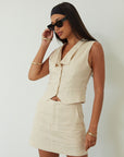 Woven sleeveless top. Front button down closure. Fully lined. Woven skirt. Hook and eye and zipper fly. Side pockets. Fully lined. summer set. cute casual outfit. summer outfit. skirt set. vest top set. tan skirt and vest set