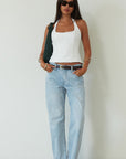 Mid rise bowed straight leg jeans. Button and zipper fly. Five pocket construction. Straight leg bows at the knees for an arched, barrel leg silhouette. Ankle length crop with a clean hem. No stretch. 