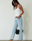 Mid rise bowed straight leg jeans. Button and zipper fly. Five pocket construction. Straight leg bows at the knees for an arched, barrel leg silhouette. Ankle length crop with a clean hem. No stretch. 