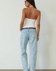Mid rise bowed straight leg jeans. Button and zipper fly. Five pocket construction. Straight leg bows at the knees for an arched, barrel leg silhouette. Ankle length crop with a clean hem. No stretch. 