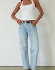 Mid rise bowed straight leg jeans. Button and zipper fly. Five pocket construction. Straight leg bows at the knees for an arched, barrel leg silhouette. Ankle length crop with a clean hem. No stretch. 
