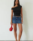 Denim skirt. Button and zipper fly. Five pocket construction. Raw edge hem. Unlined. mid wash denim skirt. dark wash denim skirt. denim mini skirt. summer skirt