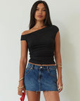 Denim skirt. Button and zipper fly. Five pocket construction. Raw edge hem. Unlined. mid wash denim skirt. dark wash denim skirt. denim mini skirt. summer skirt