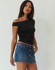 Denim skirt. Button and zipper fly. Five pocket construction. Raw edge hem. Unlined. mid wash denim skirt. dark wash denim skirt. denim mini skirt. summer skirt
