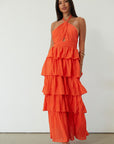 Crinkle woven tiered maxi dress. Adjustable halter tie neckline. Back hook and eye and zipper closures. Fully lined. orange maxi dress. wedding guest dress. evening dress. vacation dress. fancy dinner dress