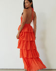 Crinkle woven tiered maxi dress. Adjustable halter tie neckline. Back hook and eye and zipper closures. Fully lined. orange maxi dress. wedding guest dress. evening dress. vacation dress. fancy dinner dress
