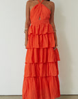 Crinkle woven tiered maxi dress. Adjustable halter tie neckline. Back hook and eye and zipper closures. Fully lined. orange maxi dress. wedding guest dress. evening dress. vacation dress. fancy dinner dress