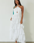 Crinkle woven tiered maxi dress. Adjustable halter tie neckline. Back hook and eye and zipper closures. Fully lined. white maxi dress. wedding guest dress. evening dress. vacation dress. fancy dinner dress. engagement dress. bridal shower dress.