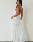 Crinkle woven tiered maxi dress. Adjustable halter tie neckline. Back hook and eye and zipper closures. Fully lined. white maxi dress. wedding guest dress. evening dress. vacation dress. fancy dinner dress. engagement dress. bridal shower dress.