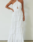 Crinkle woven tiered maxi dress. Adjustable halter tie neckline. Back hook and eye and zipper closures. Fully lined. white maxi dress. wedding guest dress. evening dress. vacation dress. fancy dinner dress. engagement dress. bridal shower dress.