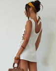 Woven sleeveless dress. Side ring details. Back zipper closure. Fully lined. white mini dress. high neck line mini dress. summer dress. engagement dress. bridal shower dress.