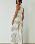 Striped woven pants. Hook and eye and zipper fly. Side pockets. Unlined. beige striped pant. work pant. casual work pant. vacation outfit. vacation pant.