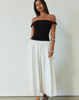 Colorblocked maxi dress. Knit bodice. Woven skirt. Twisted straps. Fully lined. white and black maxi dress. off the shoulder dress. twist strap