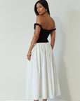Colorblocked maxi dress. Knit bodice. Woven skirt. Twisted straps. Fully lined. white and black maxi dress. off the shoulder dress. twist strap