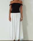 Colorblocked maxi dress. Knit bodice. Woven skirt. Twisted straps. Fully lined. white and black maxi dress. off the shoulder dress. twist strap