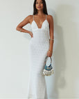 Knit lace maxi dress. Adjustable crisscross back straps. Back hook and eye and zipper closures. Fully lined. white maxi dress. engagement dress. bridal shower dress. beach wedding dress. vacation dress. beach vacation dress.