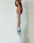 Knit lace maxi dress. Adjustable crisscross back straps. Back hook and eye and zipper closures. Fully lined. white maxi dress. engagement dress. bridal shower dress. beach wedding dress. vacation dress. beach vacation dress.
