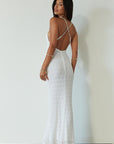 Knit lace maxi dress. Adjustable crisscross back straps. Back hook and eye and zipper closures. Fully lined. white maxi dress. engagement dress. bridal shower dress. beach wedding dress. vacation dress. beach vacation dress.
