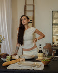 Knit lace top. Asymmetric neckline. Ruched sides. Fully lined. European summer tank top. European summer aesthetic. Tuscany outfit inso. Tuscany aesthetic. Summer tank top. white tank top. summer outfit. everyday tank top. vacation top. outfit to wear to tuscany. going out top. day tank top. coquette tank top. white lace tank top. white off the shoulder top.