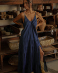 Tiered denim maxi dress. Adjustable straps. V-neckline. Front slit. Low back. Unlined. European summer aesthetic. Tuscany outfit inso. Tuscany aesthetic. Summer dress. denim maxi dress. summer outfit. everyday dress. vacation dress. outfit to wear to tuscany. day dress.
