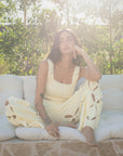 European summer vacation. European summer outfit. European summer. European summer top. European summer aesthetic. Tuscany outfit inso. Tuscany aesthetic. Summer top. yellow knit set. knit set. knit pant set. yellow floral cut out pant. yellow knit tank top