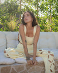 European summer vacation. European summer outfit. European summer. European summer top. European summer aesthetic. Tuscany outfit inso. Tuscany aesthetic. Summer top. yellow knit set. knit set. knit pant set. yellow floral cut out pant. yellow knit tank top