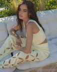 European summer vacation. European summer outfit. European summer. European summer top. European summer aesthetic. Tuscany outfit inso. Tuscany aesthetic. Summer top. yellow knit set. knit set. knit pant set. yellow floral cut out pant. yellow knit tank top