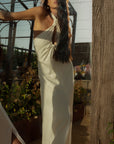 Woven maxi dress. Adjustable halter neckline with tie closure. Front slit. Back hook and eye and zipper closures. Fully lined. European summer. European summer dress. European summer aesthetic. Tuscany outfit inso. Tuscany aesthetic. Summer dress. white dress. white maxi dress. summer outfit. everyday dress. vacation dress. outfit to wear to tuscany. nice dinner dress. dinner dress. fancy dinner dress. white halter maxi dress. bride dress. engagement dress. engagement party dress