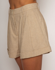 Woven high waisted linen shorts
Zipper button closure
Belt loops
Faux back pocket
Side pockets
Bottom fold up detail
Unlined
Summer tan linen shorts
Resort wear