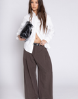 Low rise pant
Loose fit
Wide leg
Front/back pockets
Zipper closure
Unlined
Length: 39"
Lyocell/Spandex
brown low rise slack pant