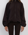 brown Windbreaker long sleeve jacket
Zip up closure
Rollable hood with zip closure
Adjustable drawstring hem and sleeve hem
Partially lined
fall transition outfit
