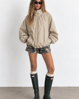 beige Oversized jacket features a slouchy silhouette, a lightweight cotton-blend fabrication, and a timeless funnel-neck collar for added dimension
Raglan sleeves
Front zipper closure
Side slit pockets