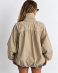 beige Oversized jacket features a slouchy silhouette, a lightweight cotton-blend fabrication, and a timeless funnel-neck collar for added dimension
Raglan sleeves
Front zipper closure
Side slit pockets