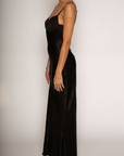 Textured black satin maxi dress. Adjustable elastic straps. Back hook and eye and zipper closures. Partially lined. black wedding guest dress